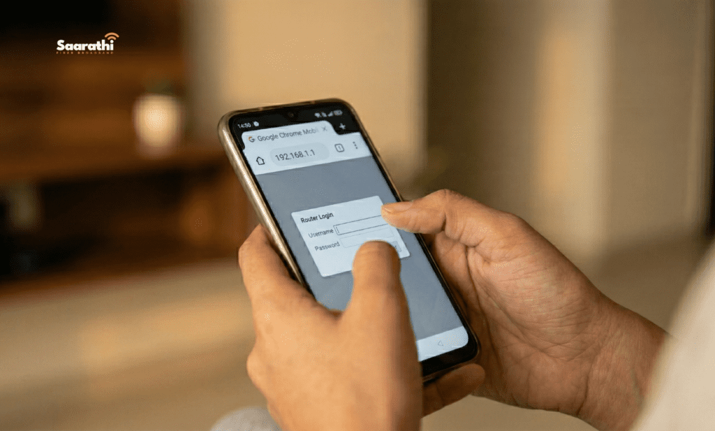 A close-up of an Indian woman's hands typing '192.168.1.1' into the Google Chrome address bar on a smartphone to change WiFi password from mobile in a Pune living room.