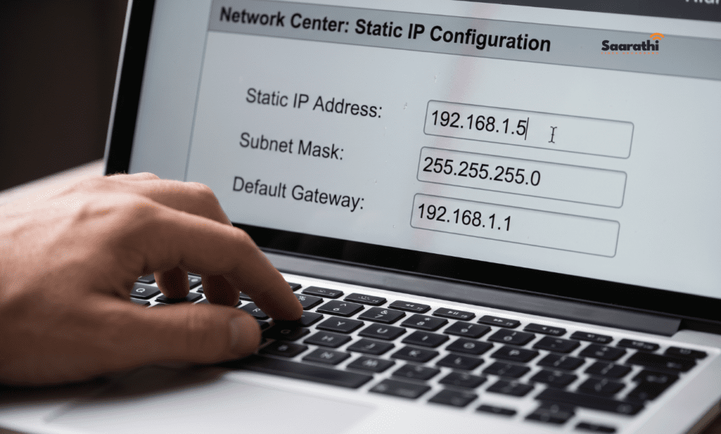 Typing a new static IP address, subnet mask, and default gateway into a router administration panel.