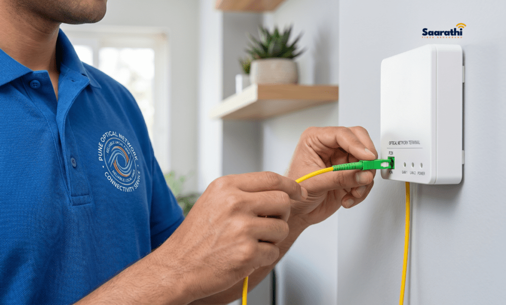 Fiber broadband technician installing a router for a reliable local internet connection.