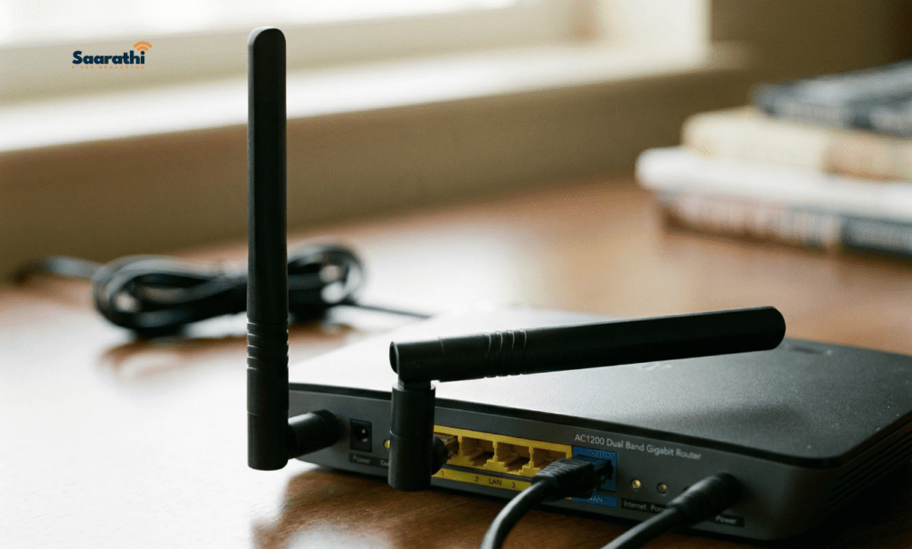 Close-up of a WiFi router with one antenna pointing straight up and the other laying flat horizontally.